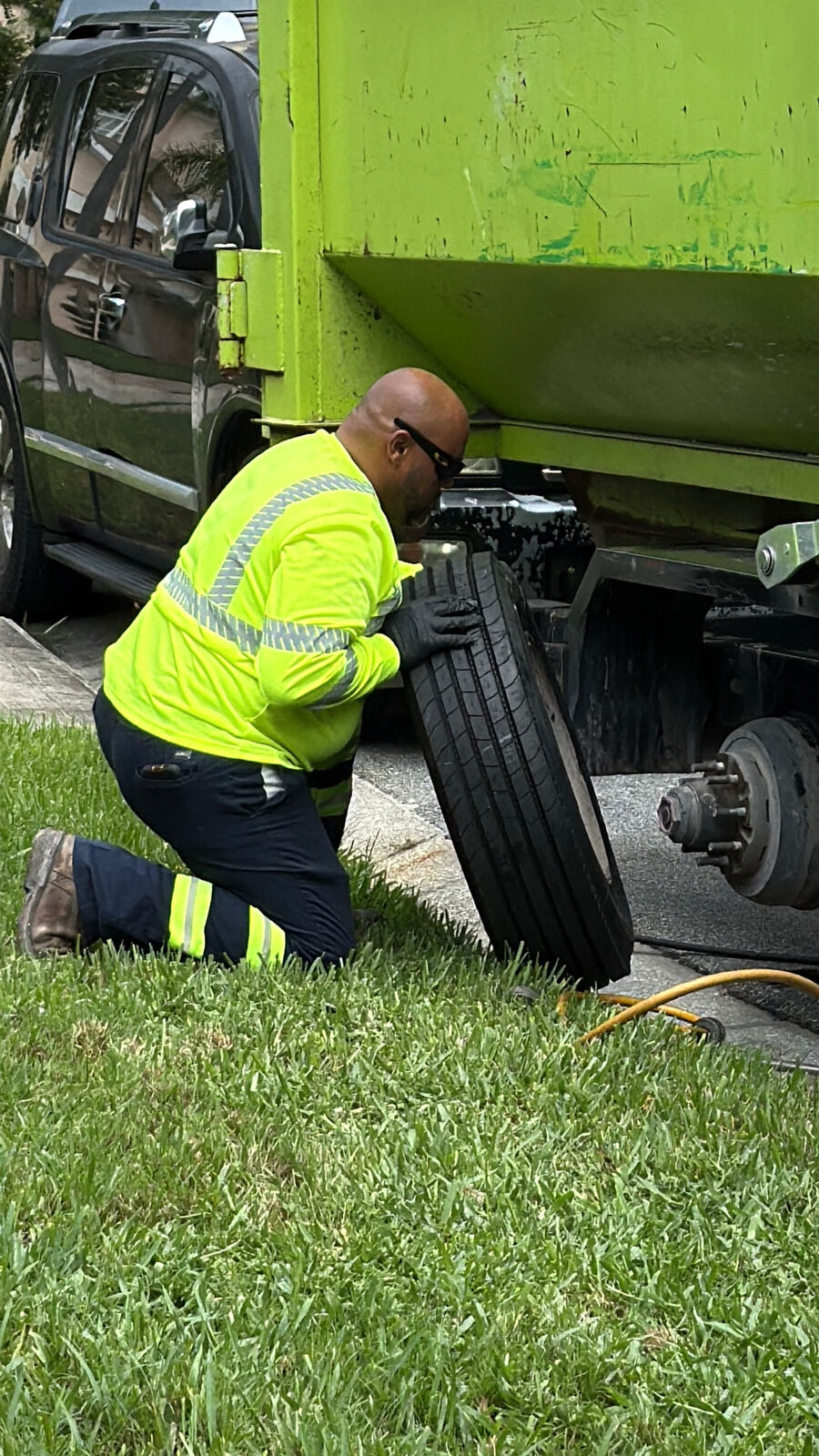 MTS technician removing a dump truck tire